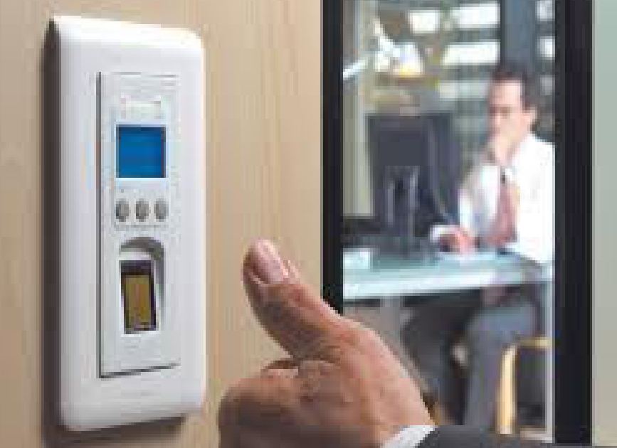 Fingerprint reader beside a glass office door