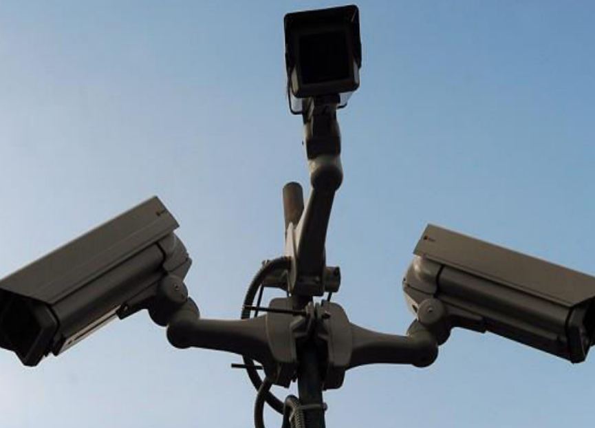Multiple bullet cameras fixed to a street-light pole