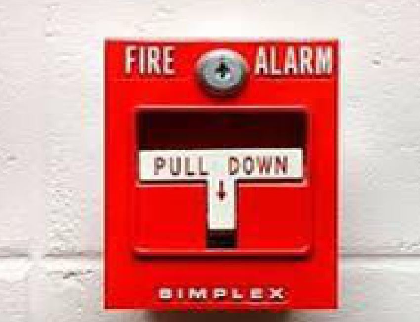 Manual fire alarm pull station mounted on a wall